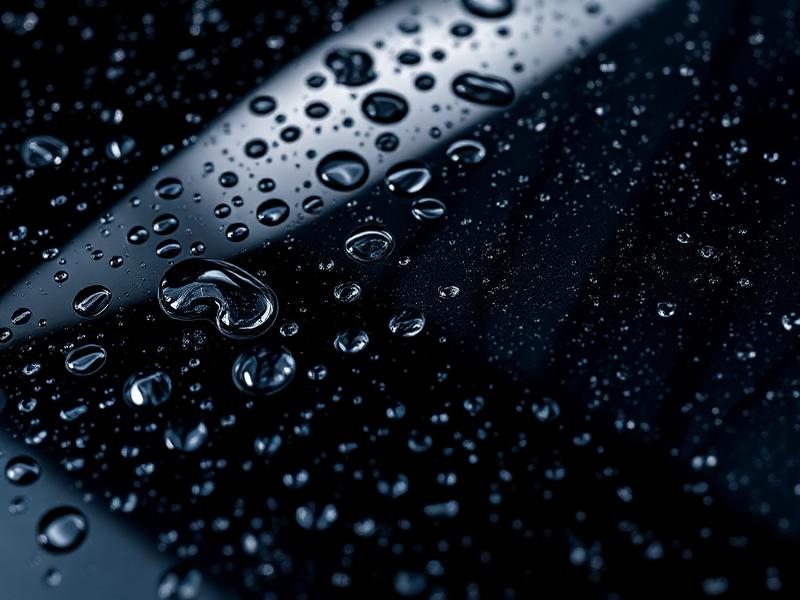 Hydrophobic water beading on ceramic coated car surface in Lakeway TX