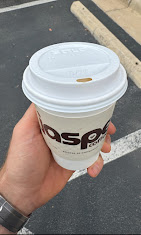 Jasper Coffee cup held outside Texas Hand Wash